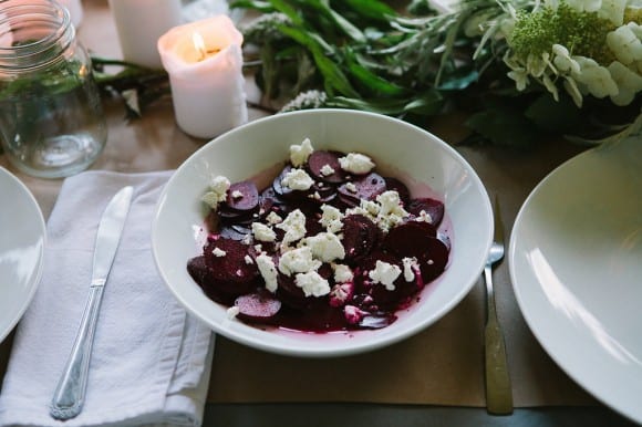 Pickled beet salad on a plate with the table set