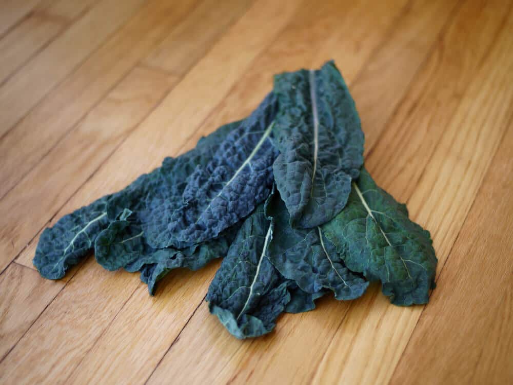 Stack of kale leaves on a table