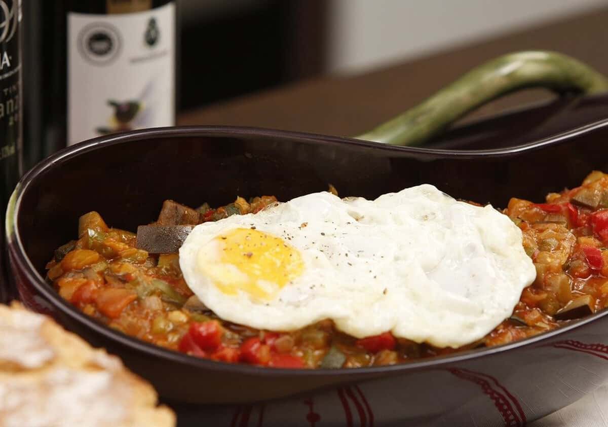 ratatouille dish with fried egg on top