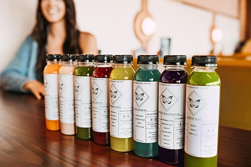 Butterfly Juice Co. row of bottles