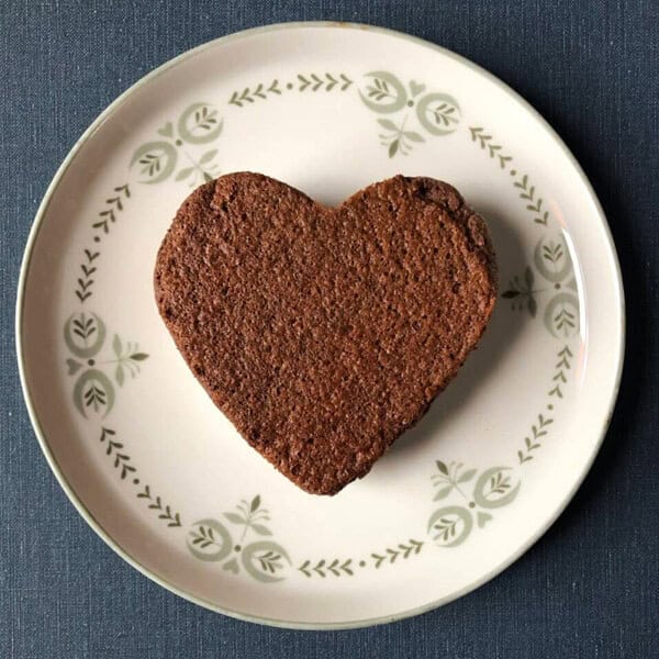 brownie on a plate in the shape of a heart